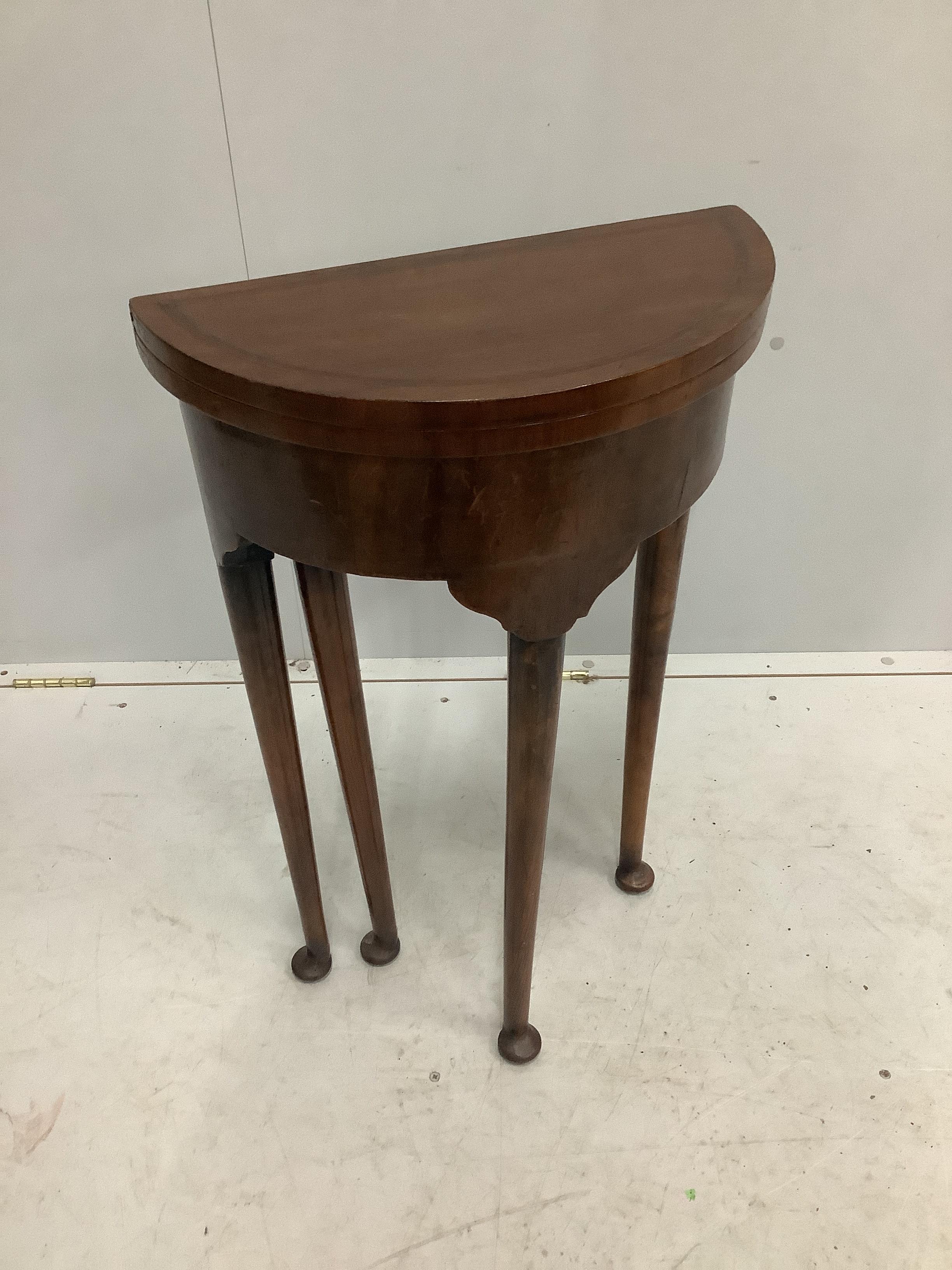 A small reproduction George III style circular topped mahogany D shaped folding table, diameter 44cm, width 22cm, height 73cm